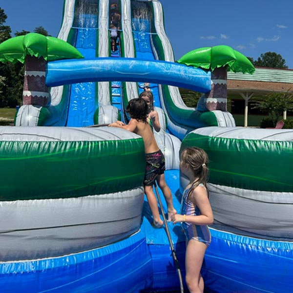 kids playing on inflatable slide